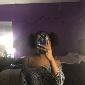 An off the shoulder stripped dress